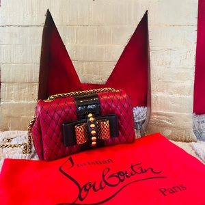 Christian Louboutin mini charity red and black.
